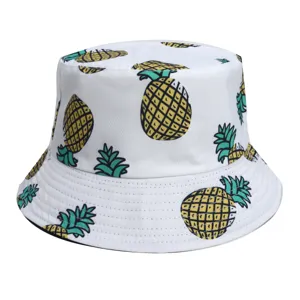 Casual white bucket hat featuring a vibrant yellow and green pineapple print, stylish summer sun hat.