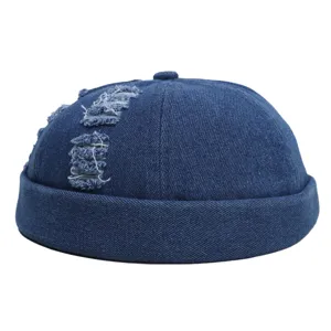 Blauwe denim docker pet voor heren, vintage versleten opgerolde rand zeemansmuts.