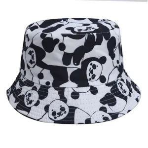 Detail view of the cute black and white cartoon panda pattern on the stylish fabric bucket hat.
