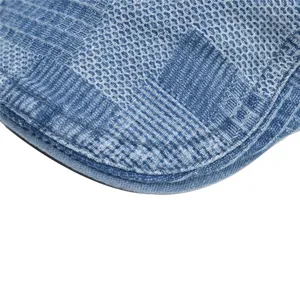 Detailed close-up view showing the fine texture and neat stitching of the denim flat cap.