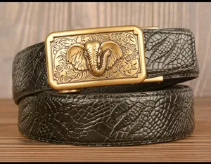 Detailed view of men leather belt featuring automatic buckle with elephant and floral carving.