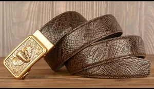 Close-up view of mens brown leather belt featuring embossed crocodile pattern and gold elephant buckle.