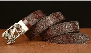 Detailed view of a retro men's leather belt with dragon automatic buckle and floral embossing.