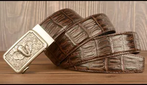 Detailed view of men's brown top layer cowhide leather belt with exquisite metal elephant buckle.