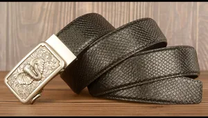 Men's cowhide leather belt detail showing elephant auto buckle and snakeskin pattern.