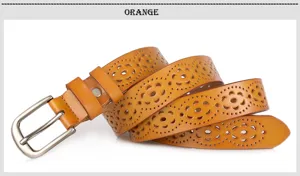 Detail shot of the stylish hollow-out leather belt with delicate floral patterns and pin buckle.