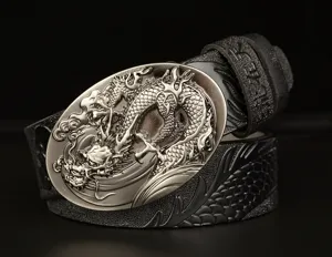 Detail view of men's leather belt with metallic carved dragon buckle and embossed patterns.