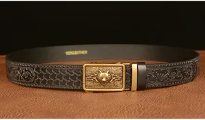 Detailed view of mens automatic buckle leather belt featuring a wolf head and elegant scroll patterns.