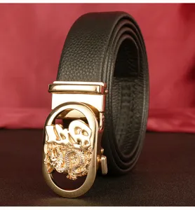 Detailed view of black genuine leather mens belt with gold automatic dragon pattern buckle.