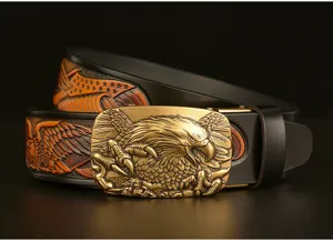 Vintage carved cowhide leather belt featuring a detailed 3D brass eagle automatic buckle.