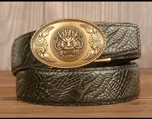 Close-up of the vintage dragon metal buckle and detailed textured cowhide leather belt surface.