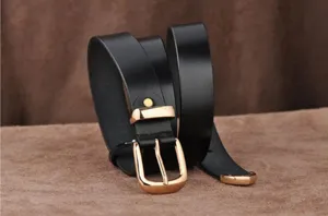 Black leather belt detail showing metal buckle and texture for women's jeans and dresses.