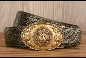 Leather belt dragon buckle detail shot showcasing textured pattern and metal clasp.