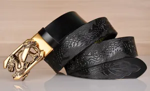Detailed view of men's leather belt with embossed dragon pattern and gold automatic buckle.