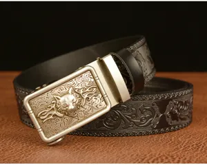 Detailed view of men automatic buckle leather belt featuring wolf head and carved floral patterns.