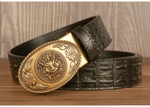 Close-up detail of mens automatic leather belt featuring ornate dragon buckle and crocodile pattern.