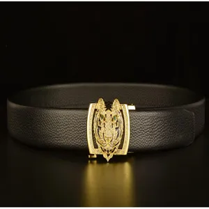 Detail shot of men's leather belt featuring a luxury rhinestone tiger head automatic buckle.
