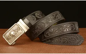 Men automatic buckle leather belt with carved wolf head detail and vintage scroll pattern.
