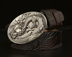 Mens leather belt detail with metallic dragon buckle and embossed strap ethnic style.