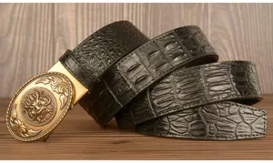 Men black alligator pattern leather belt with vintage golden dragon automatic buckle detail.