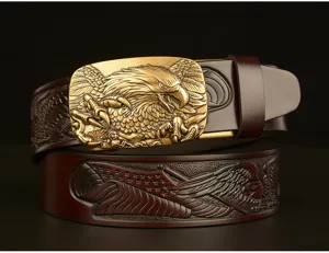 Detailed close-up shot of men's leather belt featuring a golden eagle buckle and embossed strap.
