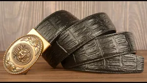 Close-up view of the black embossed leather belt featuring an intricate vintage dragon buckle.