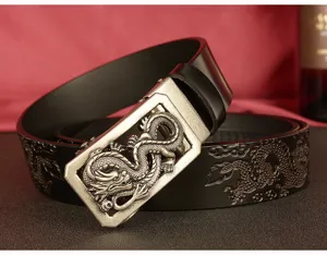Detail shot of men's leather belt featuring intricate embossed dragon pattern and metal buckle.