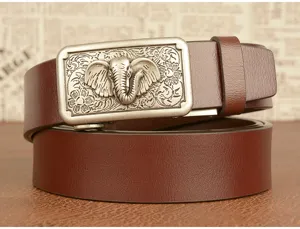 Close-up detail of vintage style brown leather belt with detailed metal elephant buckle.