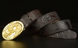 Detailed view of men embossed dragon cowhide leather belt featuring a luxury gold buckle