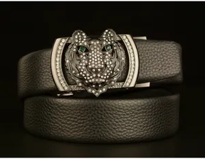 Men's leather belt with rhinestone tiger head automatic buckle, detailed close-up shot.