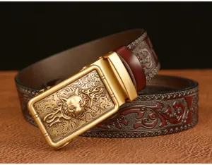 Detailed view of men's leather belt with intricate wolf head metal automatic buckle design.