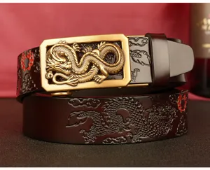 Close-up detail of luxury men's genuine leather automatic buckle belt with embossed dragon design.