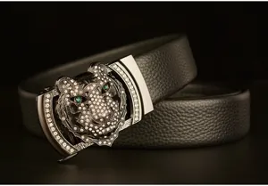 Men's leather belt detail view showcasing rhinestone tiger head automatic buckle and texture.