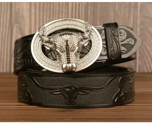 Men's leather belt with rhinestone bull head automatic metal buckle and embossed strap design.