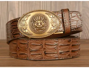 Detailed view of men's brown embossed crocodile pattern leather belt with vintage dragon metal buckle.