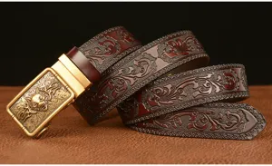 Men's leather belt with wolf head buckle and embossed floral pattern for casual wear.