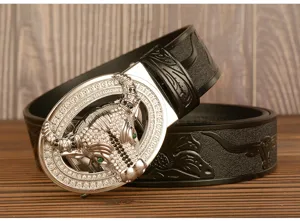 Detailed view of men's leather belt featuring rhinestone bull head buckle and embossed strap.