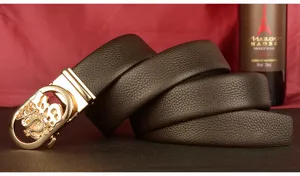 Close-up detail of mens genuine leather belt with automatic gold metal buckle stylish design.