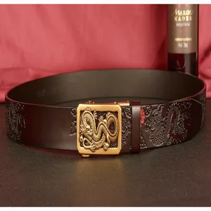 Men's leather belt with embossed dragon pattern and brass automatic metal buckle for business style.