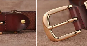 Close-up detail shot of women leather belt showing golden pin buckle and premium texture stitching.