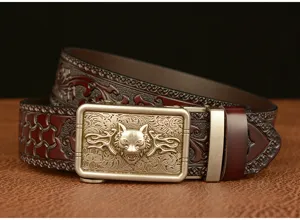 Men's leather belt with wolf head buckle and embossed floral pattern for casual wear.