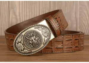 Detailed close-up view of vintage dragon metal buckle and embossed crocodile leather belt.