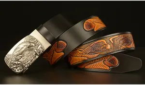 Men's vintage carved cowhide leather belt with metallic eagle automatic buckle accessory.