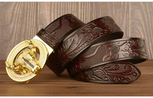 Men's leather belt with rhinestone bull head automatic buckle and embossed vintage strap.