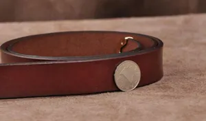 Classic brown leather women belt detail showing high quality material and texture.