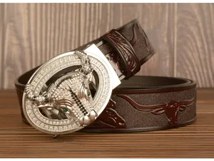 Close-up of mens brown leather belt with rhinestone bull buckle and embossed pattern.