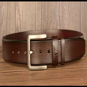 Detailed view of a dark brown genuine leather belt with a stylish metal pin buckle and bull head emblem.