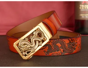 Detailed view of mens leather automatic belt with Chinese dragon pattern and metal buckle.