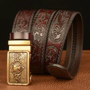 Men's stylish automatic buckle leather belt with embossed wolf head and intricate scroll carvings.