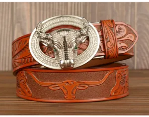 Men's leather belt with dazzling rhinestone bull buckle and embossed floral pattern design.